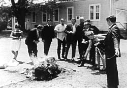 Mary Moylan adds to the flames during the Catonsville Nine's action in 1968.